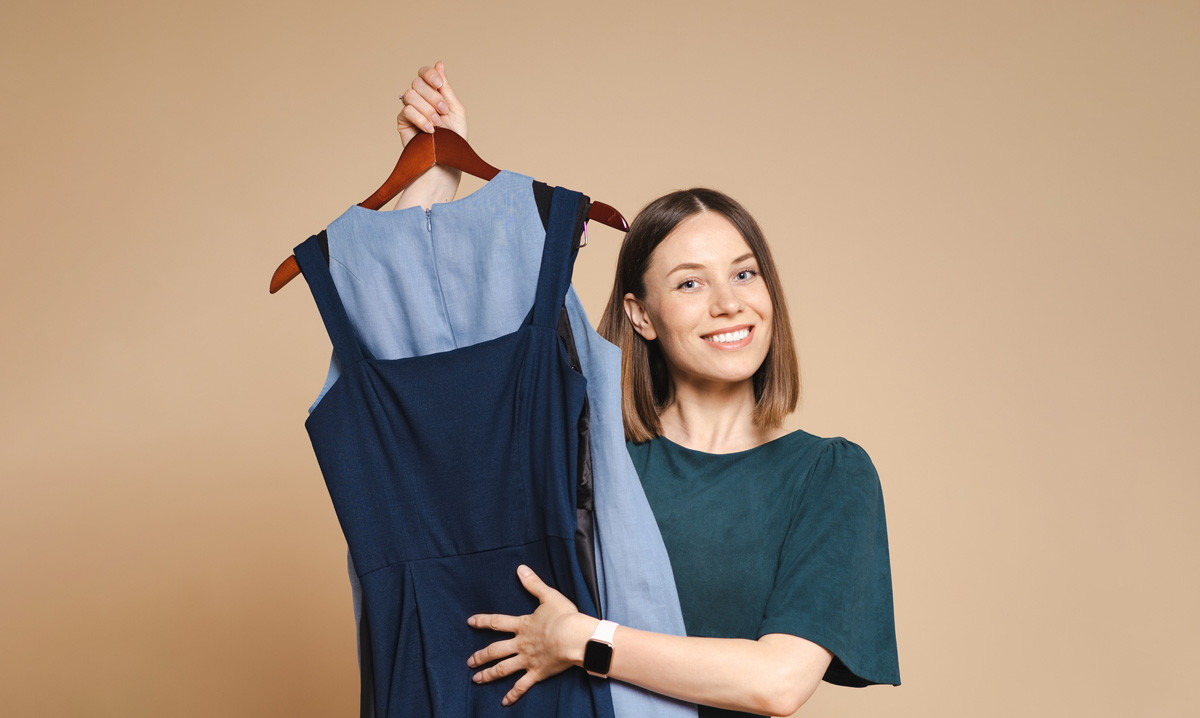 Woman holding clothes